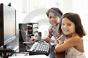 Hispanic children using computer at home