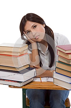 Hispanic college student woman with stack of books