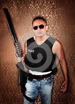 Hispanic Cop Holding Gun