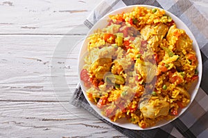 Hispanic cuisine: Arroz con pollo close up in a bowl. Horizontal