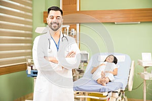 Hispanic doctor with a pregnant patient