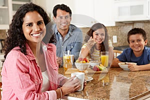 Hispanic family eating breakfast