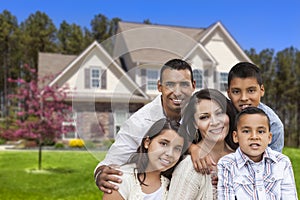 Hispanic Family in Front of Beautiful House