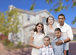 Hispanic Family in Front of Beautiful House