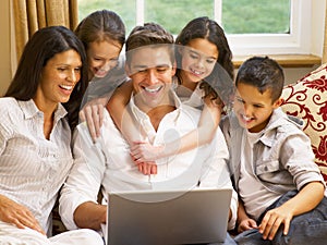 Hispanic family at home online shopping