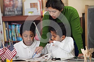 Hispanic Family in Home-school Setting Studying Rocks