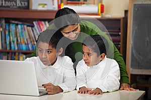 Hispanic Family with Laptop in Home-school Setting