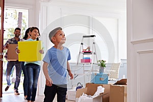 Hispanic Family Moving Into New Home photo