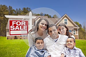 Hispanic Family, New Home and For Sale Real Estate Sign