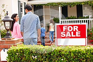 Hispanic family outside home