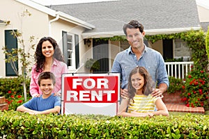 Hispanic family outside home for rent