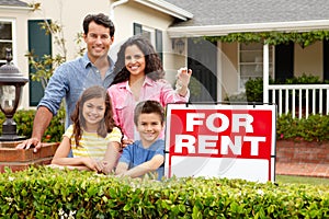 Hispanic family outside home for rent