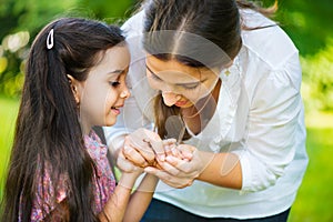 Hispanic family playing in sunny park