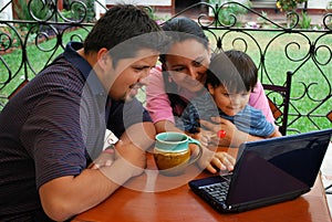 Hispanic family using a computer