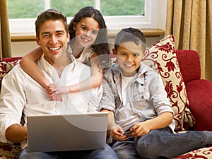 Hispanic father and children shopping online