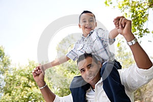 Hispanic Father and Son Having Fun in the Park