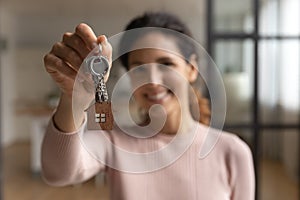 Hispanic female happy homeowner look at camera celebrate getting mortgage photo