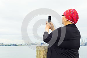 Hispanic Female Uses Cell Phone