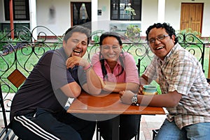 Hispanic friends laughing together