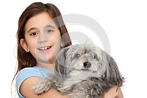 Hispanic girl hugging her dog isolated on w