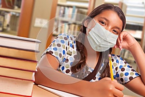 Hispanic Girl Student Wearing Face Mask Studying in Library