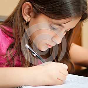 Hispanic girl working on her homework