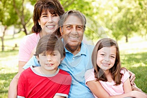 Hispanic grandparents and grandchildren outside