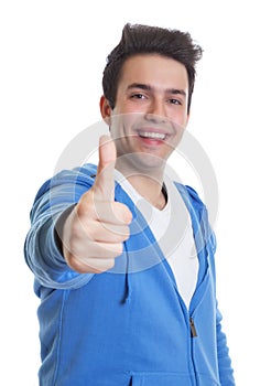 Hispanic guy in a blue hoody showing thumb up