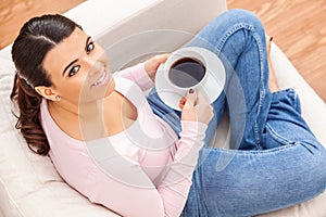 Hispanic Latina Girl Young Woman Relaxing Drinking Cup of Tea or Coffee at Home