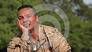 Hispanic Male Soldier Daydreaming Wearing Camo