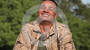 Hispanic Male Soldier Laughing Wearing Camo