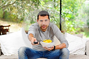 Hispanic male wearing light blue sweater plus