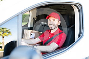 Hispanic male worker working as a delivery driver