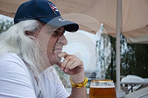 hispanic man with beer. cuban old man drinking beer. senior man drink beer from glass outdoor. Enjoy in pub. lager beer. summer