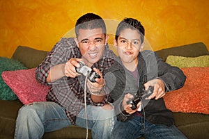 Hispanic Man and Boy Playing Video game