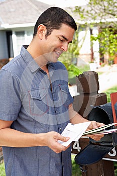 Hispanic Man Checking Mailbox