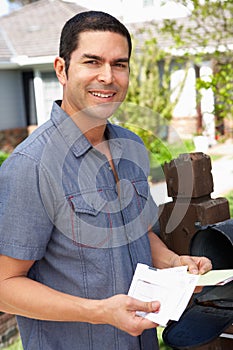 Hispanic Man Checking Mailbox