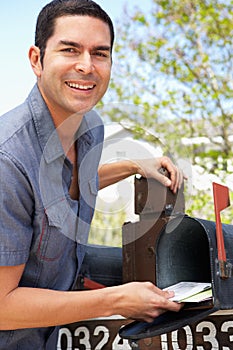 Hispanic Man Checking Mailbox