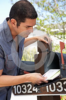 Hispanic Man Checking Mailbox
