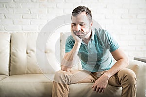 Hispanic man depressed after a break up