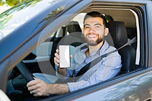 Hispanic man using the phone while driving