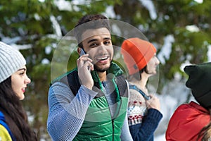 Hispanic Man Using Smart Phone Call Snow Forest Young People Group Walking Outdoor Winter