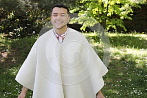 Hispanic man wearing a ruana photo