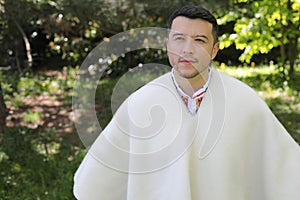 Hispanic man wearing a ruana photo