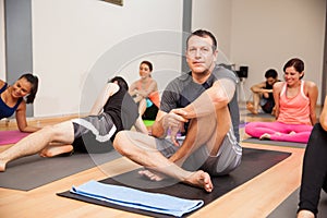 Hispanic man in yoga class
