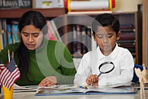 Hispanic Mom and Boy in Home-school Setting