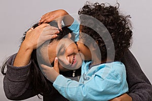 Hispanic Mom with Curly Hair Child