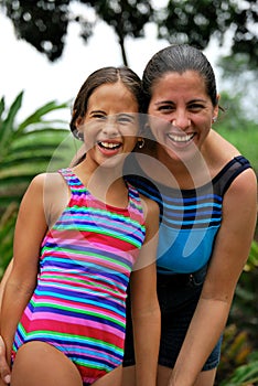 Hispanic Mother and daughter smiling