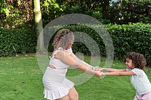 Hispanic Mother and daughter spending time outdoors