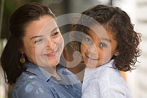 Hispanic mother and her daughter.